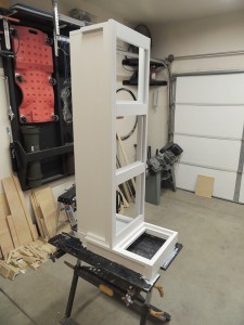 Applied first coat of paint to passenger side overhead cabinet-switch box assembly