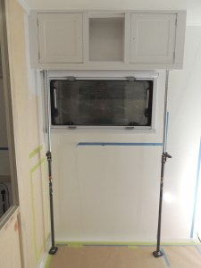 Bonded and installed upper kitchen cabinet