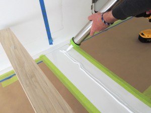 Bonded and screwed lower bed wall member to habitat floor