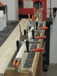 Bonded edge trim to bathroom wall