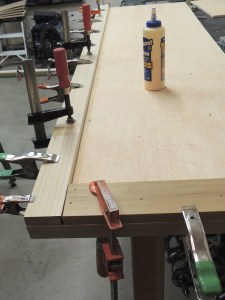 Bonded edge trim to bathroom wall