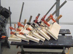 Bonded top trim on cubby dividers