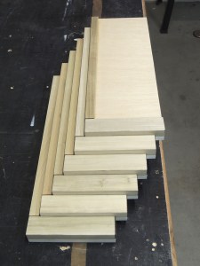 Bonded top trim on cubby dividers