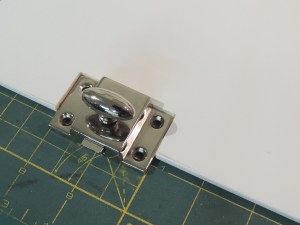 Cut latch opening in pantry door faces
