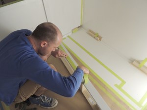 Dry fit, masked, prepped, bonded, screwed, and installed kitchen cabinet riser