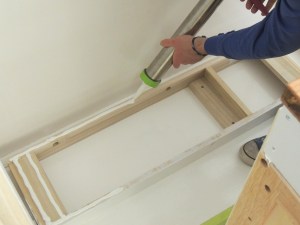 Dry fit, masked, prepped, bonded, screwed, and installed lower kitchen cabinet