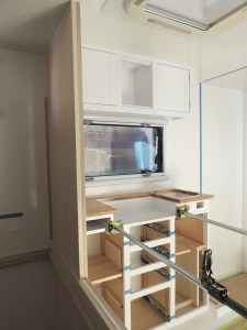 Dry fit, masked, prepped, bonded, screwed, and installed lower kitchen cabinet