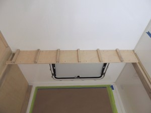 Fit checked headboard and cubby components in habitat