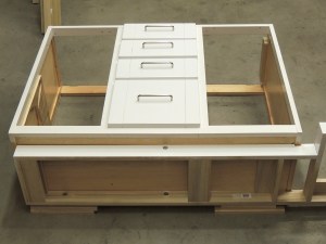 Fit riser to bottom of kitchen cabinet