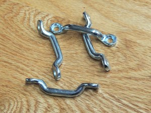 Installed footman's loops for securing cabinet contents