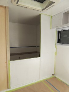 Masked and applied first coat of paint to forward side of driver side bed wall