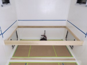 Prepped, bonded, and screwed bed support rails into habitat