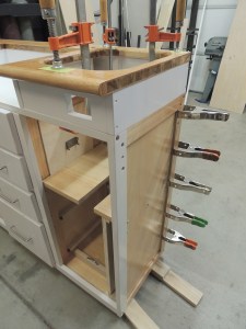 Prepped, bonded, and screwed kitchen cabinet top and back wall