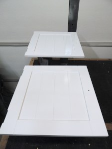 Sprayed top coat on upper kitchen cabinet and doors