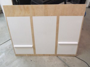 Started painting base board and back of lower kitchen cabinet