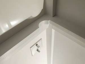 Clearanced passenger side table mount rail for wire clearance