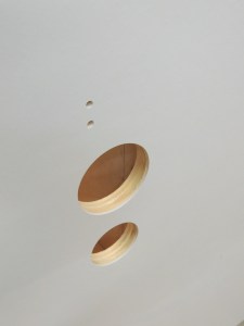 Drilled holes in shower area divider for shower fixture