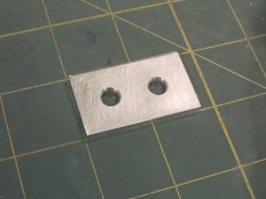 Fabricated spreader plate for internal grab handle mount