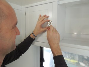 Installed latches on kitchen upper cabinets