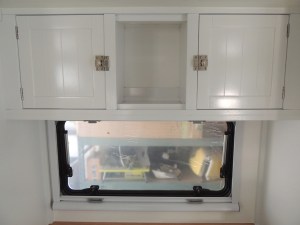 Installed latches on kitchen upper cabinets