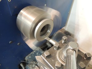 Machined mounting plate for ground power plug