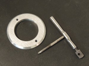 Machined mounting plate for ground power plug