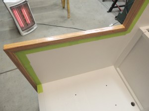 Masked and urethaned red oak edge trim on shower area divider