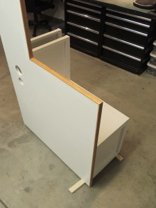 Masked and urethaned red oak edge trim on shower area divider