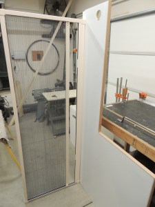 Planned entry grab handle location on shower area divider