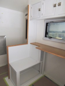 Test fit, masked, prepped, bonded, and screwed shower area divider and passenger side table