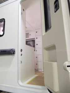 Test fit, masked, prepped, bonded, and screwed shower area divider and passenger side table