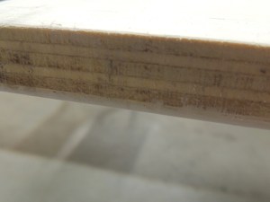 Trimmed FRP panel to edge of shower area divider