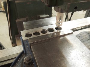 Fabricated spacer washers for ladder upper bracket