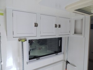 Fit checked, prepped, bonded, and screwed passenger overhead cabinet