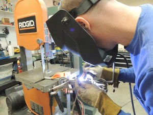 Fixtured and welded ladder subframe mount