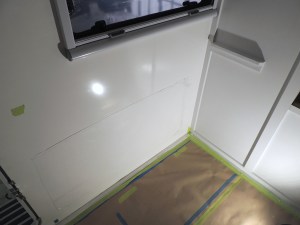 Installed and painted passenger side exterior wall table mount rail