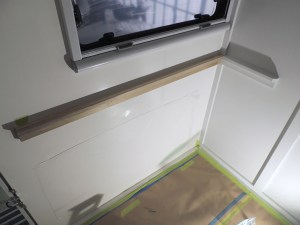 Installed and painted passenger side exterior wall table mount rail