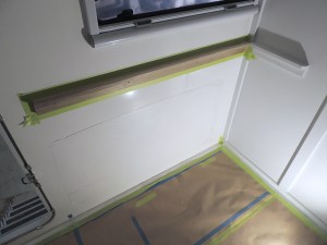 Installed and painted passenger side exterior wall table mount rail