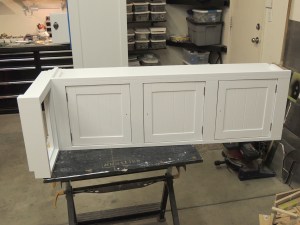 Installed doors in passenger side overhead cabinet