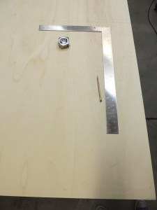 Laid out shower area divider on plywood