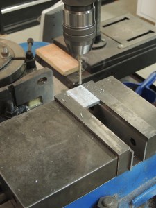 Machined spacers for cabinet door latches