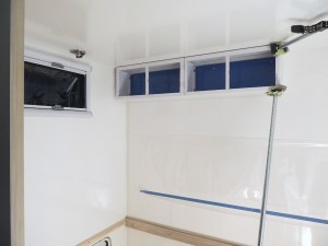 Prepped, bonded, and screwed rear over bed cabinets into habitat