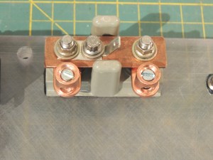 Fabricated high current positive bus bar for distribution panel