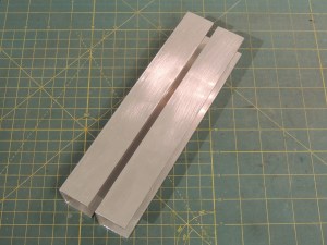 Cut aluminum channel for water jerry can support