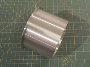 Machined aluminum sleeve to finish heater passthrough hole