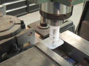 Machined refrigerator and fill pump electrical socket mounts