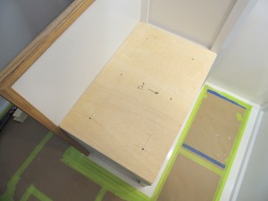 Match drilled locating holes in forward dinette bench seat cushion base