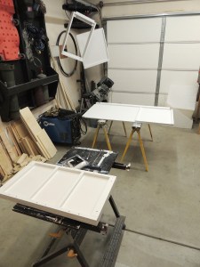 Painted under bed divider, driver side under bed storage partition, forward bench riser, and lithium battery tray