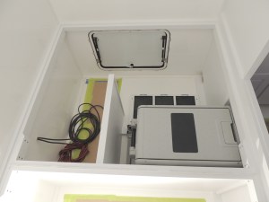 Test fit, masked, prepped, and bonded under bed divider and storage partition