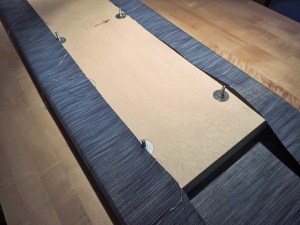 Upholstered and assembled seat bases